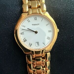 Tissot Gold Timepiece with White Face